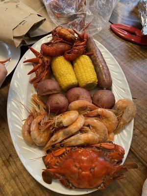 Crab, shrimp, crawfish, sausage, potatoes and corn. There was more but this is all that fit on the serving platter!