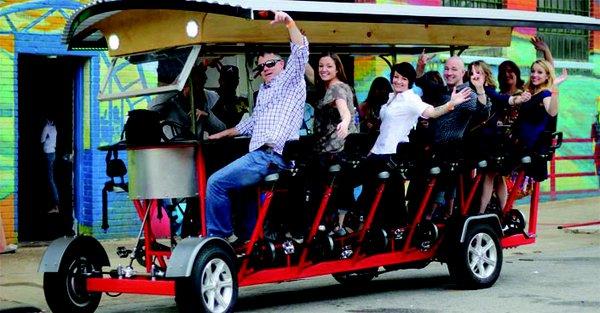 People enjoying a Pedal Saloon tour around Fort Worth.