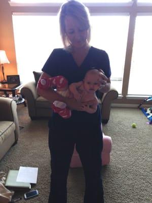 Jennifer demonstrating an effective new stretch for our daughter's torticollis. As awkward as it looks, she actually enjoyed it!