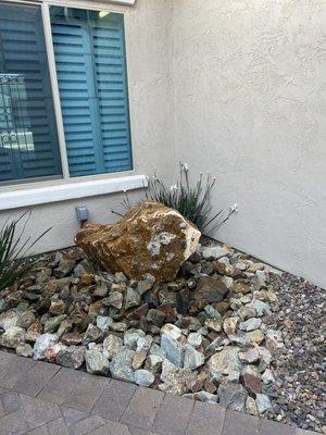 Gorgeous rock fountain with accent rock.