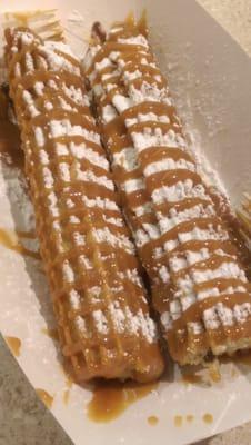 Churro filled w nu tell a and topped w dulce De leche and powdered sugar