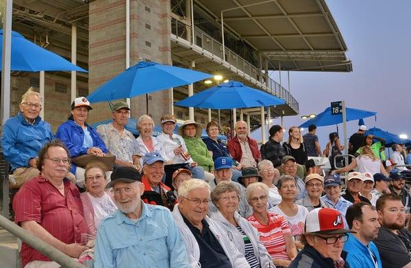 Residents attend a Hops baseball game