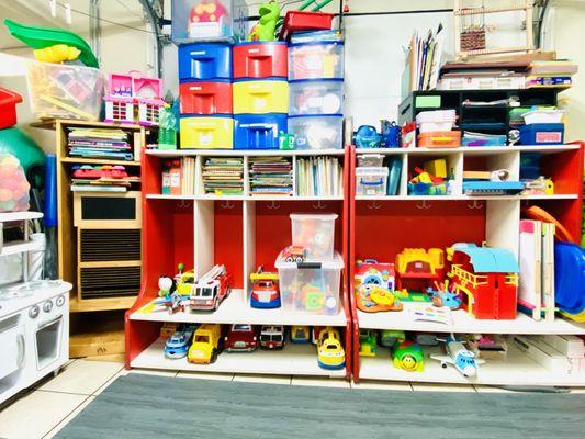 Trucks, trains, doll houses, kitchen, art supplies, building blocks, balancing board...we are always adding more! Always something to do!