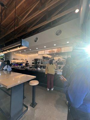 One employee working the line and cash register.