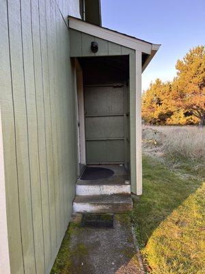 Entry way to our "cabin" Totally dark at night, unsafe ! One burned our light bulb