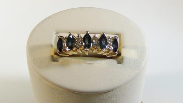 Ring size is 8;   weighs 5.8 gram
5 marquise sapphire; average 1/4 carat each; 
8 round diamonds 0.33ctw
$615.00