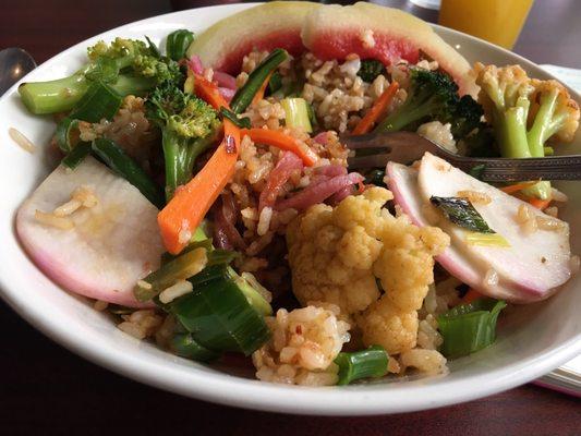 Vegan entree, veggies and pickled watermelon rind on fried rice