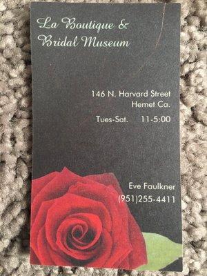 Eve Faulkner's business card and museum/store hours.