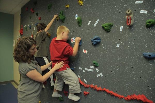 Inclusive PT on the climbing wall with Ms. Julie