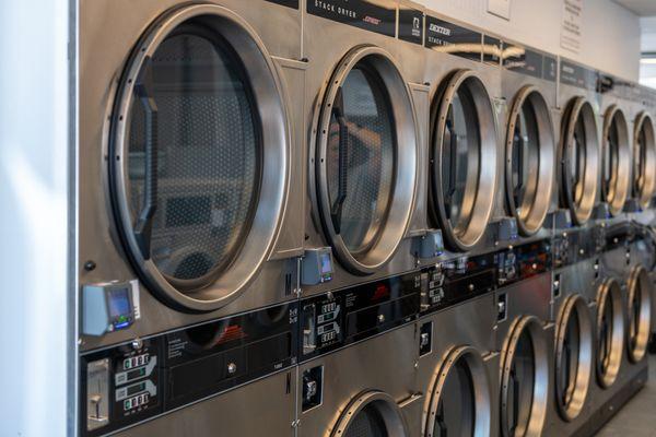 High capacity washers and dryers for self serve laundry customers.