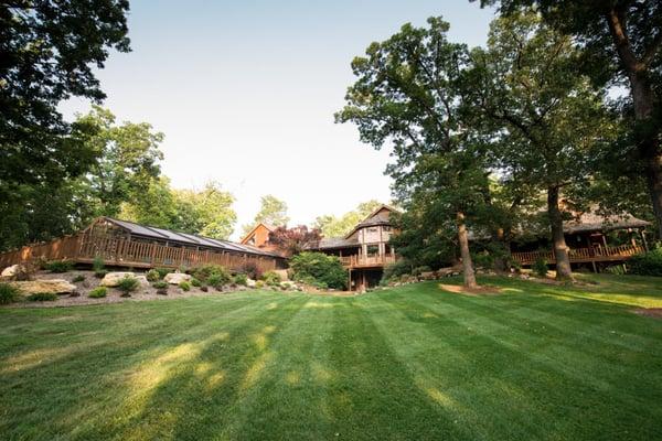 The expansive lawn is perfect of family gatherings and play.