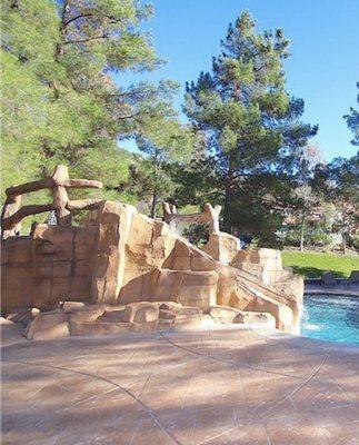 Made the steps, the slide, the grotto, waterfall, and railway around our pool. This is the back side of it.