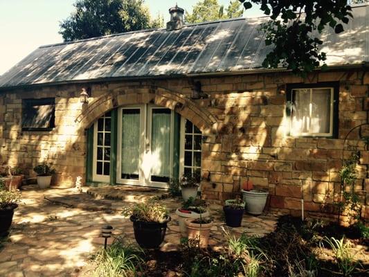 Stone cottage/refurbished smoke house. Adorable on the outside! This is the front view.