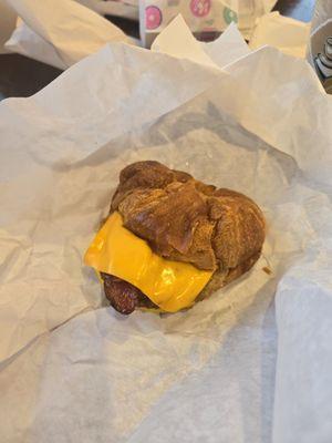 Croissant with sausage, egg, and cheese