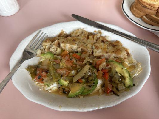 Huevos rancheros with over easy eggs. Delicious. The sauce is so simple but so amazing.