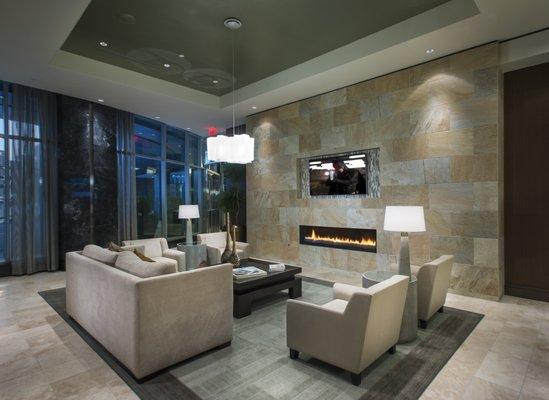 Second view of lobby lounge area with fireplace.