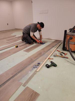 Casey installing flooring