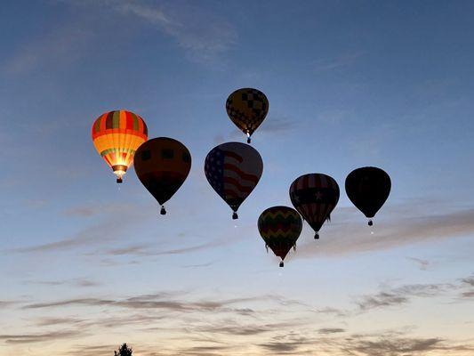 Twinkling balloons at dawn