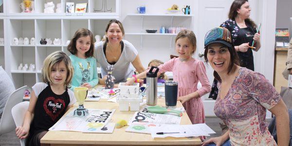 Pottery Parlor: friends hanging out and having fun while they paint their own pottery