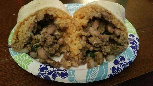 Carne asada burrito.  Too much rice n beans. Green sauce spicy.