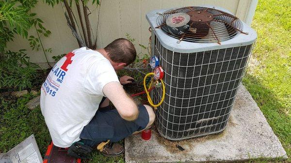 Phillip checking the refrigerant charge on this system