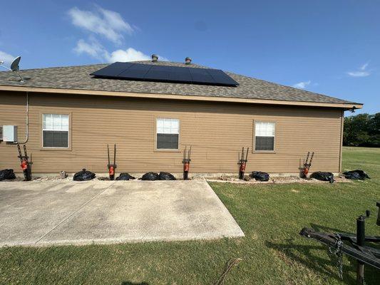 DFW home post foundation lift. Steel Piers are ready to be locked in place.