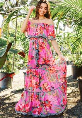 A printed maxi dress featuring off shoulder with flounce, elasticized waist with self-sash belt and tiered skirt