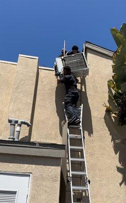 Waleed lifted and lowered an AC condensor up two stories by himself