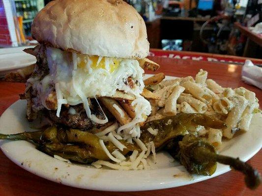 The VP Burger - 1/2 lb Burger topped with Fresh Cut Fries, Mozzarella and a Sunny Side Up Egg