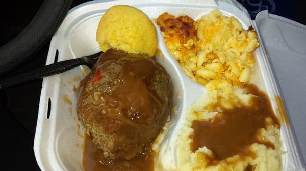 Salisbury steak dinner with mashed potatoes, mac n cheese and corn bread.