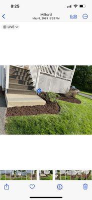 In front of (Client)'s house, where we started the Hand edge and made our islands to match and run along house/ ultra brown cedar mulch