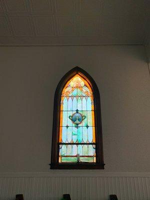 Original Stained Glass windows give it the old chapel feel. The colors are warm and inviting.