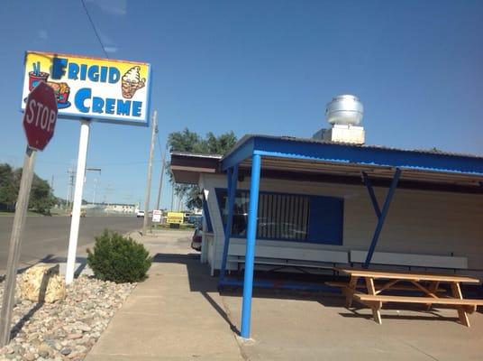 Outside the restaurant. The ordering window is there nearest the sign.