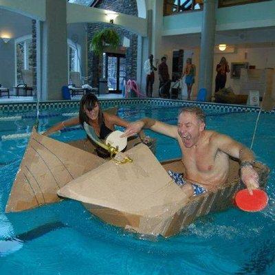 The Cardboard Boat Building Activity challenges your team to design, build, and float a boat made from cardboard  and tape!