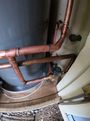 Heat-Pump Water Heater in Exterior Closet (After Photo) Install comes with expansion tank and thermostatic mixing valve.