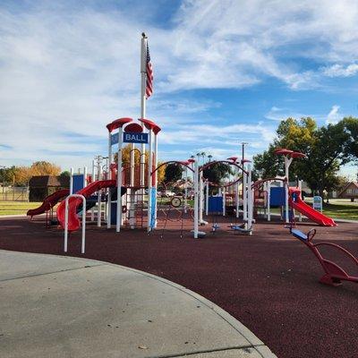 Playset near parking lot.