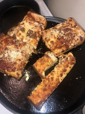 Burnt cheesy bread without no sauce.