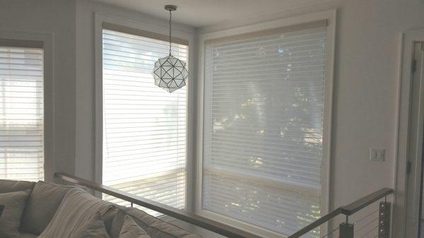 Motorized Horizontal Sheer Shades were the perfect solution for these XL hard to reach stairway windows. Stunning!