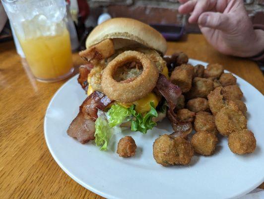 Destiny's Burger - Burger topped with fried green tomatoes, cheddar cheese, onion rings, bacon, lettuce and a homemade ranch dressing.