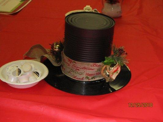 The centerpiece at each table was a top hat — suitable for snowmen everywhere — primarily made of a  #10 can and an LP.