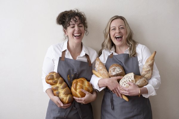 Instructors Leehe and Amanda with a bounty of bread