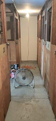 A make shift fan supposedly to cure a storage flood incident non reported to tenants. Cement floors still wet. How many days ?