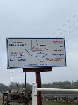 Sign at entrance with hours