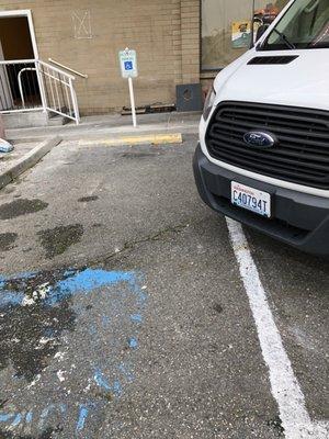 The van blocked two disabled parking spots while working on remodeling the restaurant