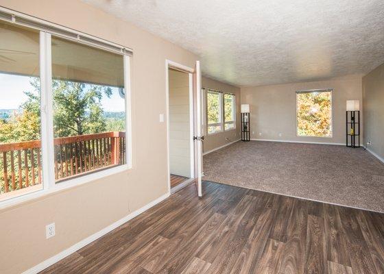 Dining Room into Living Room with Balcony through window