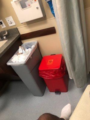 The hazard reasgxab and regular trash can.