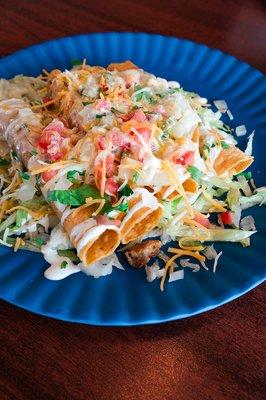 Flautas topped with Queso