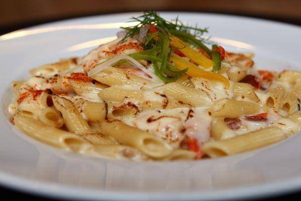 Penne Rustico -
 Black tiger shrimp, bacon, mushroom, in white sauce, topped with gratinated cheese