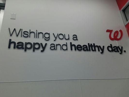 On wall near entrance. Relates to the current slogan, "on the corner of happy and healthy".