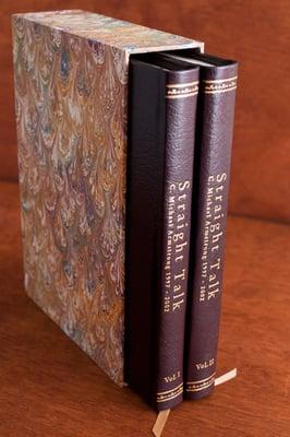 Maroon leather bookbinding with marble paper slipcase